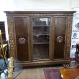 A large 20th century oak and burr-elm panelled 3-door armoire, L213cm, H191cm, D45cm