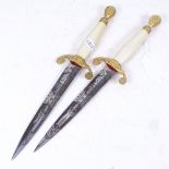 A pair of Wilkinson darts presentation daggers, with etched blades, blade length 17.5cm (2)