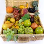 A woven wicker hamper containing composition artificial fruit