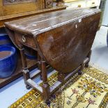 An 18th century joined oak gateleg table, W95cm