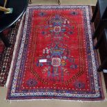 A red Persian Afshar rug, 195cm x 135cm