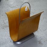 A contemporary designer plywood magazine rack in cherrywood