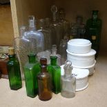 A collection of Antique glass Chemist's bottles, including Boots, green poison bottles, and