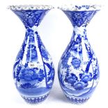 A pair of Chinese porcelain blue and white vases, with floral decoration, 44.5cm (A/F)