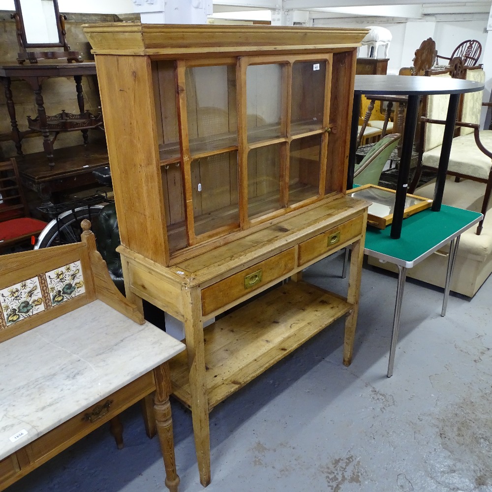 An early 20th century pine 2-section dresser, with glazed cupboards, drawers and pot board under,