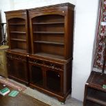 A reproduction mahogany 2-section library bookcase, with open shelves and base fitted with drawers