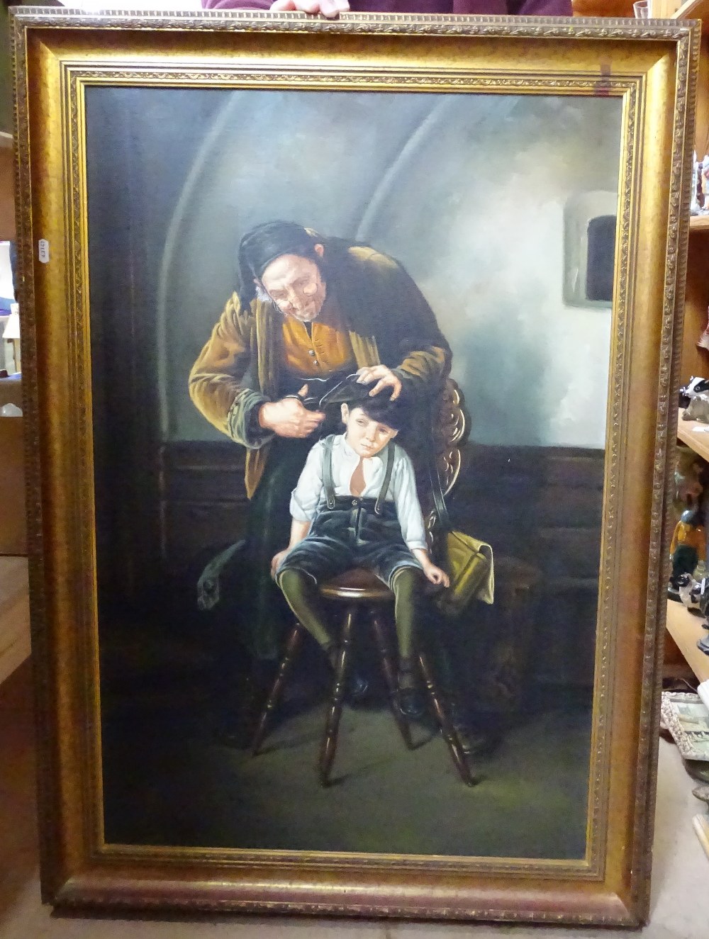 Oleograph on canvas, "the barber", gilt-framed, 106cm x 75cm