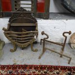 A cast-iron duck's nest fire grate, and a pair of fire dogs