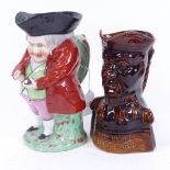 A Chelsea Pottery Toby jug, and a treacle glazed Duke of Wellington character jug, height 18cm (2)
