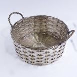 A silver plated basket-weave bread basket with glass liner, early 20th century, basket diameter