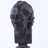 A 19th century patinated bronze head and shoulders bust of Voltaire, unsigned, height 22cm Good