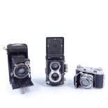 Rolleiflex Twin Lens Reflex camera, a Kodak Retina II roll film camera, and a Zeiss Ikonta folding