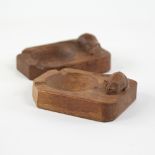 A pair of Robert "Mouseman" Thompson oak ashtrays, mid 20th century, length 10cm Good overall