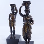 A pair of patinated bronze candleholders, in the form of Greek Classical figures, late 19th century,
