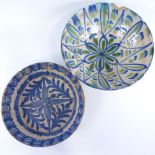 2 18th/19th century continental majolica bowls, largest diameter 31cm. Blue and white bowl has
