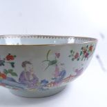 A large Chinese famille rose porcelain bowl, 18th/19th century, hand painted figures and flowers,
