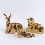 3 pieces of 19th century Wealden glazed pottery, comprising a stag, length 14cm, sheep, length 14cm,