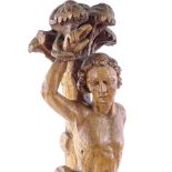 A carved wood figure of St Sebastian tied to a tree, 17th/18th century, all carved from one
