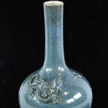 A Chinese mottled turquoise glaze narrow-neck vase with applied dragon to the neck, height 26cm