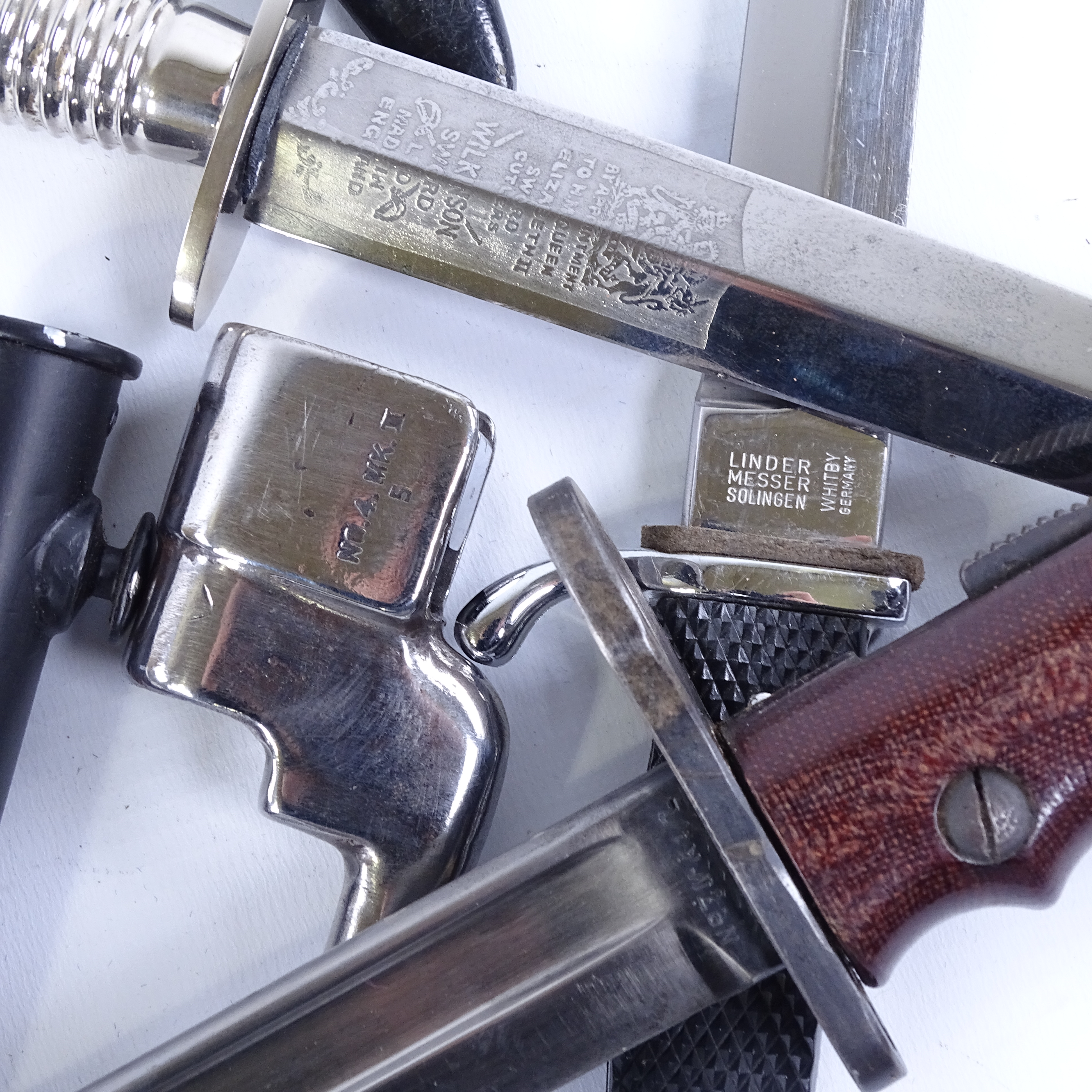 A group of knives and bayonets, comprising a Wilkinson Commando knife with metal scabbard, a No. 7 - Image 3 of 3