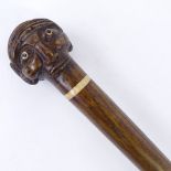A 19th / 20th century carved head walking cane, possibly made from a staff, 86cm. Good condition.