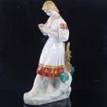 A Russian porcelain figure of a girl, height 29cm Good condition, no damage or restoration,