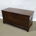 A solid mahogany coffer, probably 18th century, with brass carrying handles and bracket feet, length