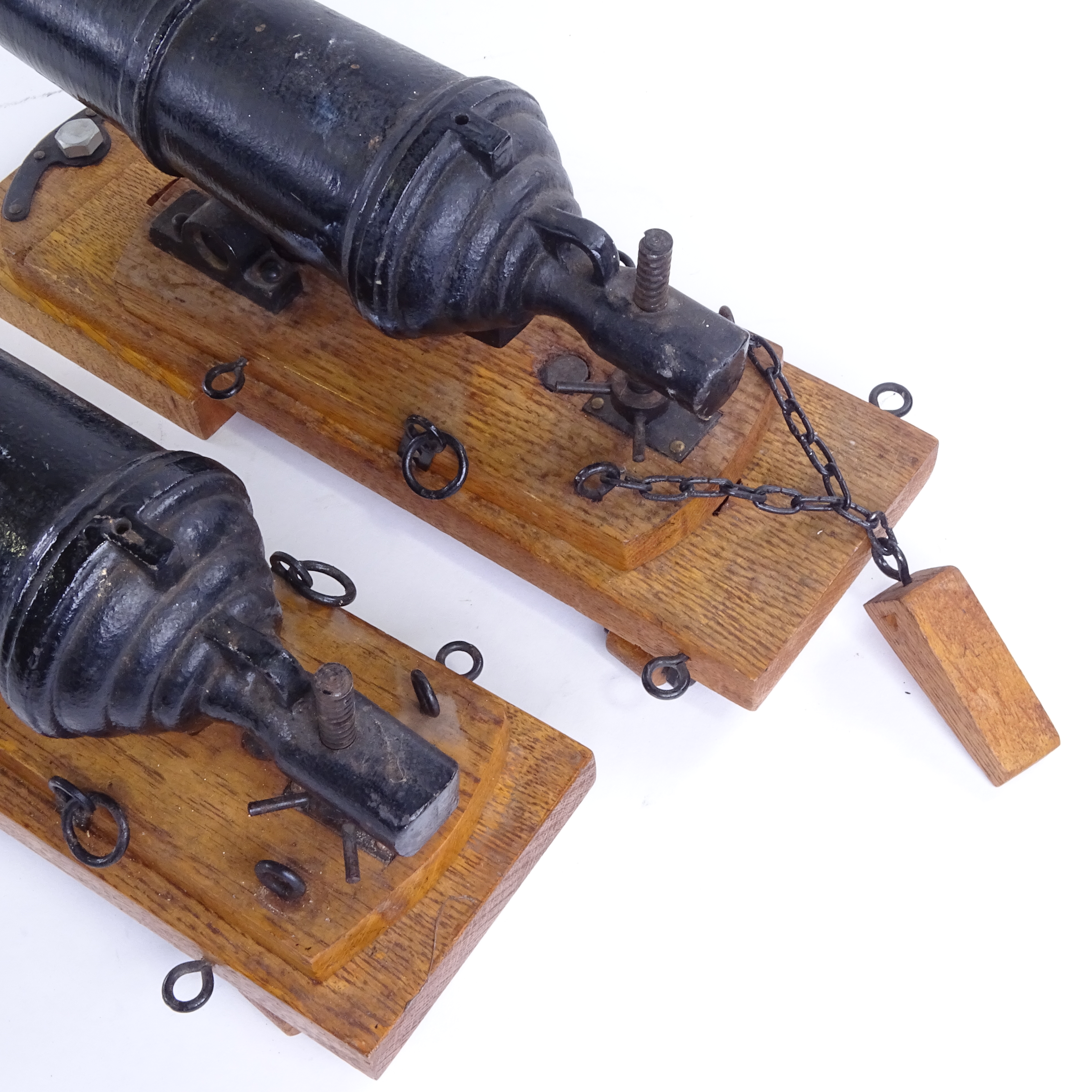 A pair of cast-iron barrelled model cannons on stained oak stands, overall barrel length 28cm, - Image 2 of 3