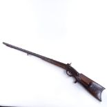 A 19th century double barrelled percussion muzzle loading sporting gun, with carved wood trigger