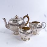 A 19th century electroplate 3-piece tea set of globular form, with carved ivory knop and armorial