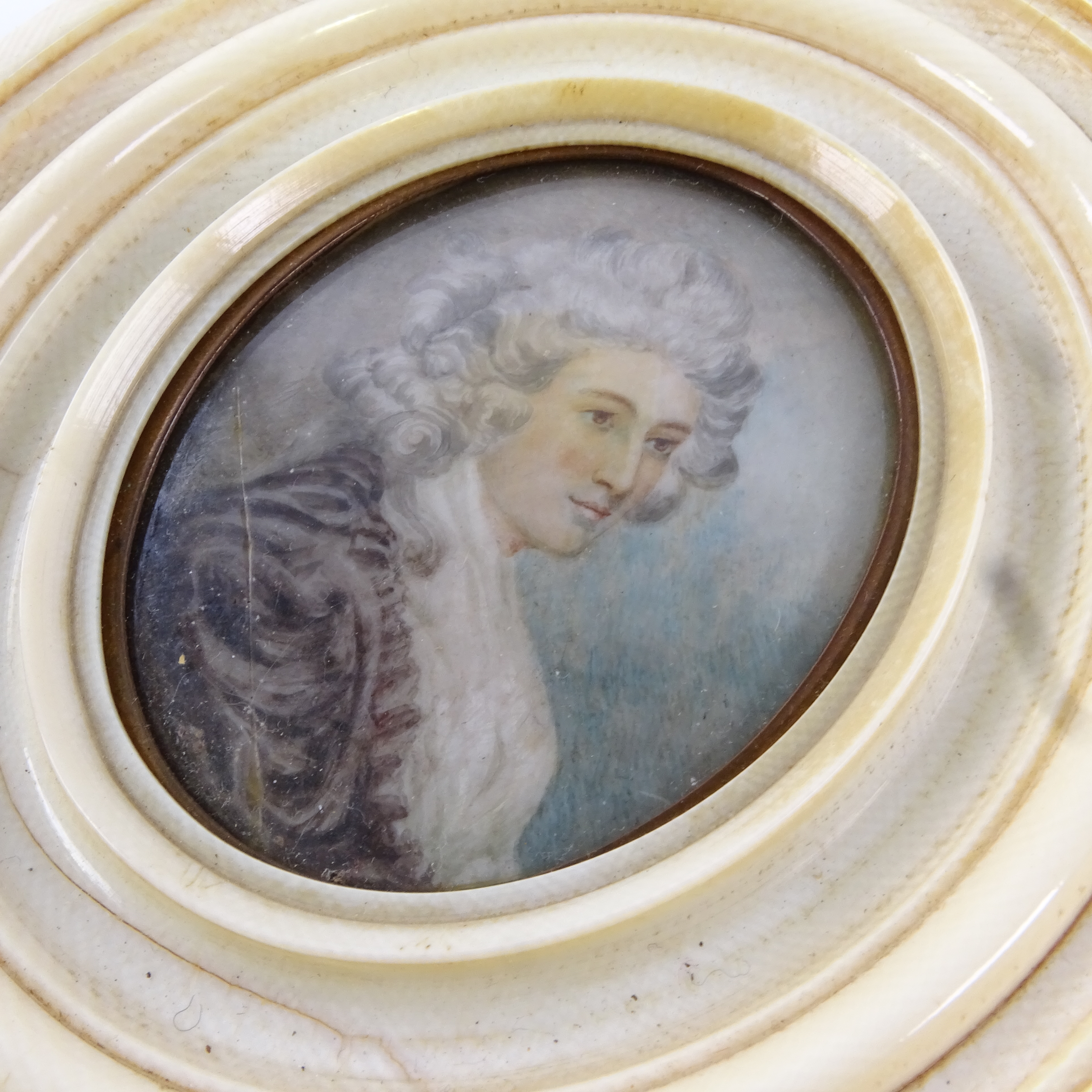 A Georgian miniature watercolour on ivory, portrait of a lady with powdered hair, unsigned in - Image 2 of 3