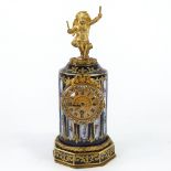 A French blue and gilt porcelain-cased mantel clock in the form of a column, surmounted by a gilt-