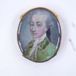 A Georgian miniature watercolour on ivory, head and shoulders portrait of a gentleman wearing a