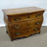 An 18th century Italian fruitwood 3-drawer bombe commode, with shaped drawer fronts, carved panelled
