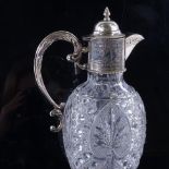 An Edwardian cut glass and silver mounted Claret jug, hallmarks Birmingham 1908, height 28cm. Good
