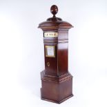 A vintage mahogany country-house post box, with applied mouldings, brass mounts and ball finial,