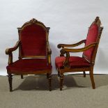 A pair of 19th century walnut and ebonised library armchairs, with acanthus carved arched backs