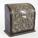 An Edwardian silver mounted stationery box, curved lid with relief embossed bird and foliate