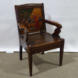 A Nordic Arts and Crafts stained pine elbow chair, with relief carved Viking back panel, eagle