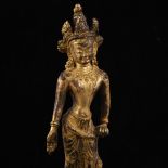 An Oriental gilt-bronze figure of Guanyin standing on a lotus flower plinth, height 16cm Gilding