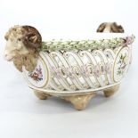 A Meissen Porcelain table centre basket, circa 1900, with ram's head handles, pierced surround and