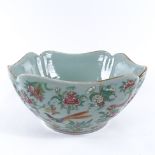 A Chinese celadon porcelain square section bowl, with enamelled birds butterflies and flowers, width