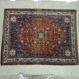 A handmade Abadeh floral decorated rug, 207cm x 158cm.