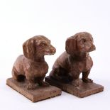 A pair of early 20th century carved oak Dachshunds, length 11cm Part of the base section in front of