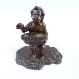 19th century patinated bronze figure of a boy holding a basket, unsigned, height 12cm, width 12cm