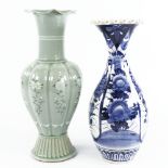 A Japanese green glazed porcelain vase with painted flowers, height 31cm, and a Japanese blue and