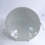 A Chinese celadon glaze porcelain footed bowl, incised decoration, diameter 19cm, in fitted fabric-