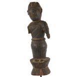 An Indian carved and stained wood figure on metal stand, overall height 47cm