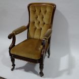 A Victorian mahogany framed open arm fireside chair