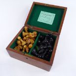 A Jaques carved and stained wood Staunton chess set, weighted pieces in original mahogany box with